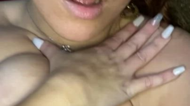 Licking and rubbing cum all over her huge tits