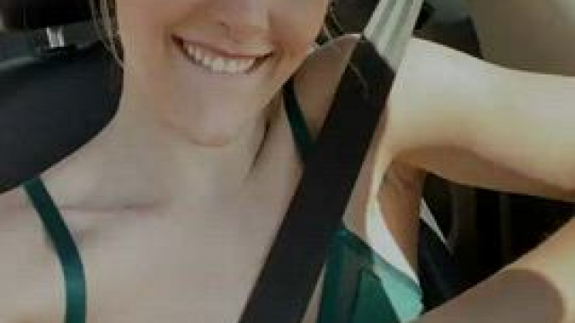 She shows off her beautiful tits while driving