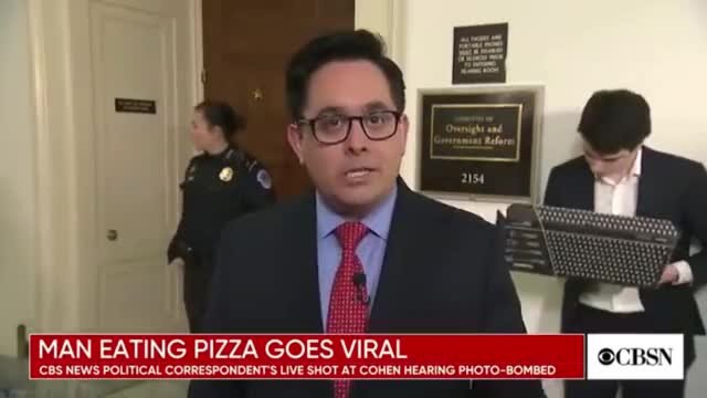 Guy gets caught eating pizza on live TV. No shame.