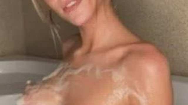 Washing her boobs with soapy water