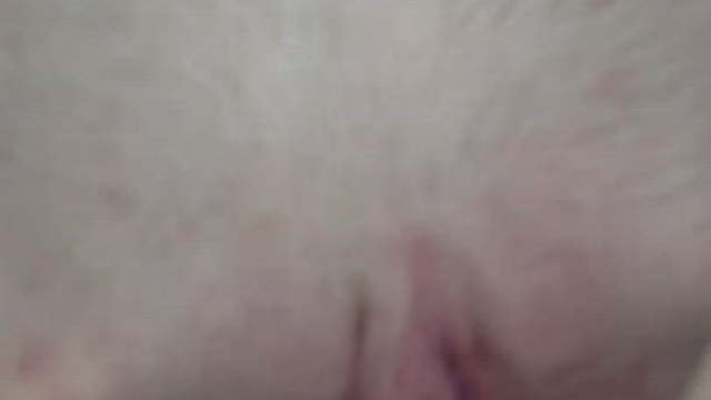 Teasing herself with a hard cock before letting it slide it