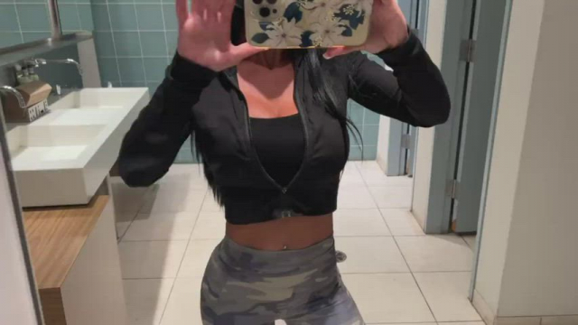 Taking her tits out in a public bathroom
