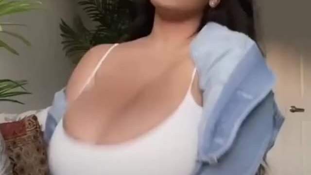 Enjoying her massive Tits