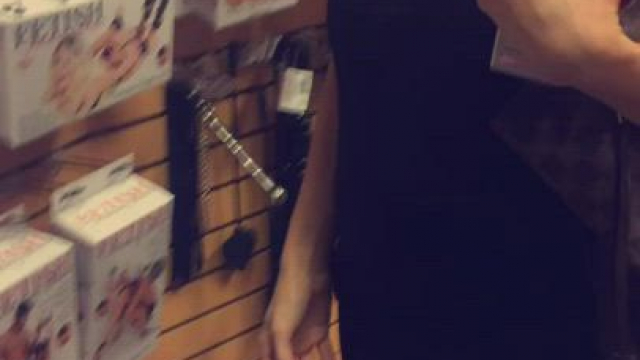 Taking vids for hubby of myself at a sex shop with his friend.